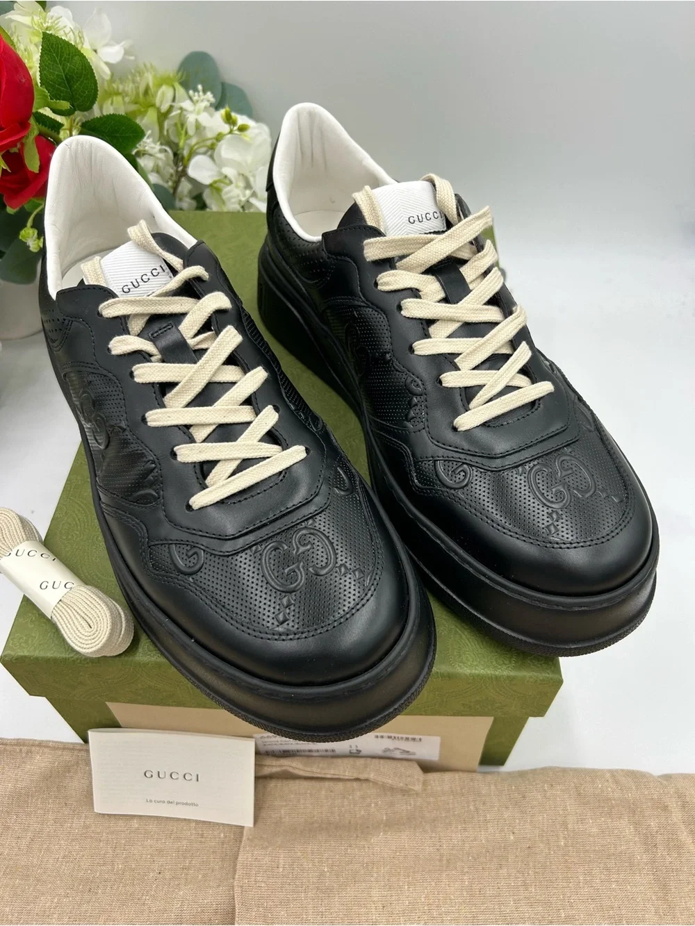 Men's Gucci, GG embossed, black leather sneakers size 11 fits 11.5 made in Italy
